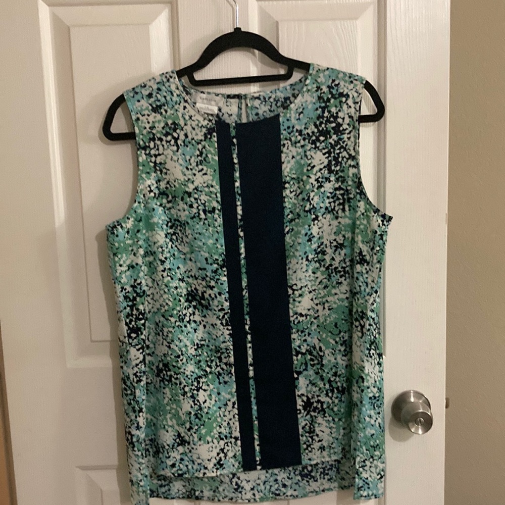 Van Heusen sleeveless blouse size L/G. 100% polyester. Made in Indonesia.